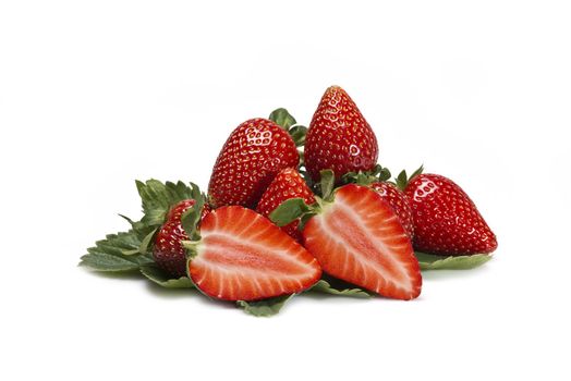 Strawberries with their leaves isolated on a white background