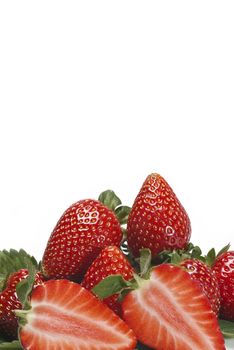 Strawberries with their leaves isolated on a white background