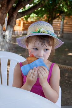 The little girl was hungry, having fun in the park