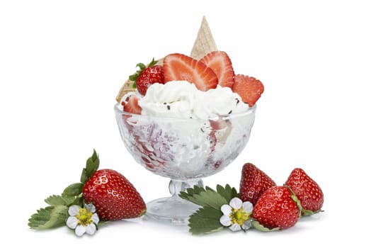 Strawberries and whipped cream cup isolated over a white background.