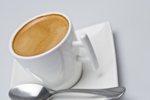 Closeup from a coffee over a white background.