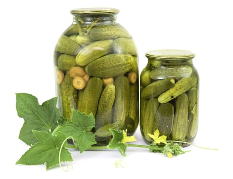Pickled cucumbers in jars on a white background
