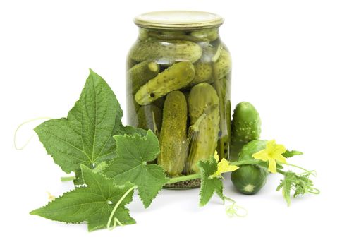 Pickled cucumbers in jar on a white background