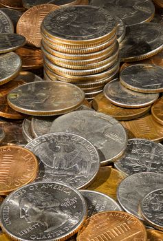 Macro image in deep focus of a pile of USA currency coins in stacks