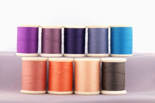 Threads in spools isolated in white background 