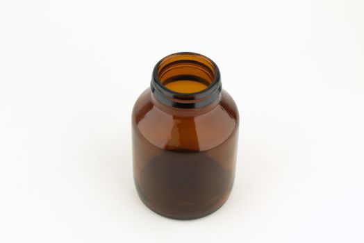 Medicine bottle of brown glass isolated on white background   
