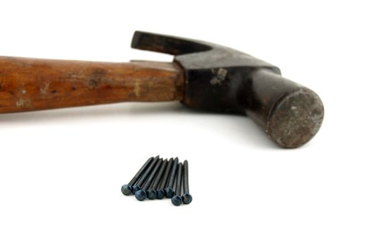 Old vintage hammer and nails for home construction     