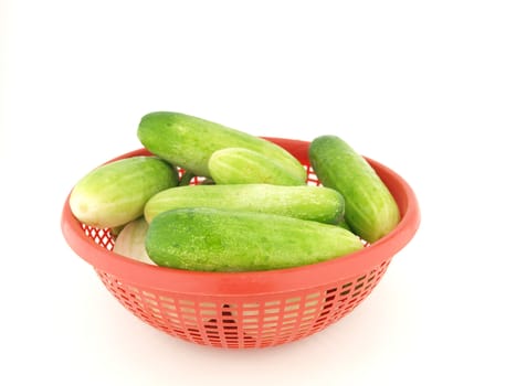 Many cucumber on red basket