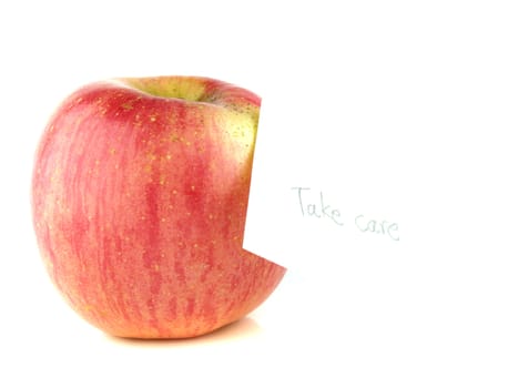 Apple with "take care" label  