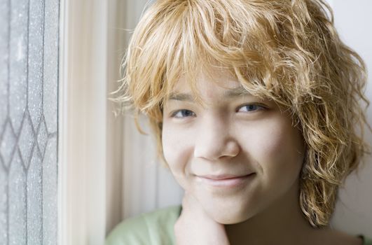 Biracial young teen girl smiling, closeup