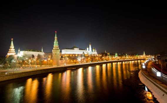 Kind to the Moscow Kremlin and Moskva River in winter night. Russia