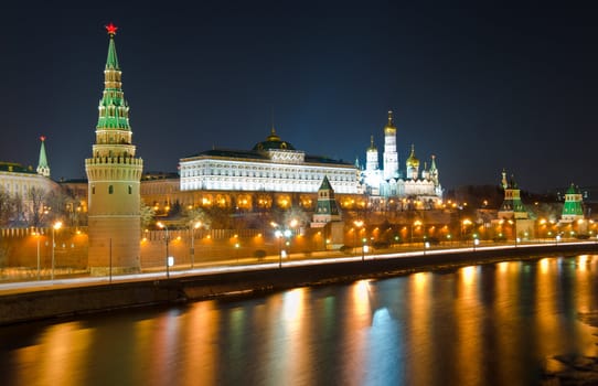 Kind to the Moscow Kremlin and Moskva River in winter night. Russia