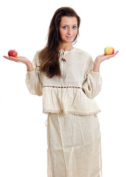 Female in national traditional costume with two apples. Isolated on white.