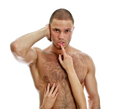 Woman's hands touching man's lips. Isolated on white.