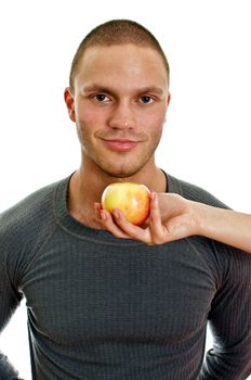 Woman's hand offering an apple to man. Isolated on white.