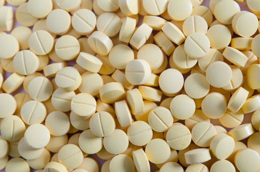 a lot of  yellow medicine  , pills  background