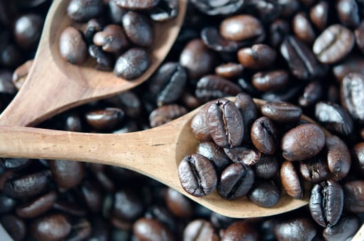 Close-Up wooden spoon of coffee beans  .