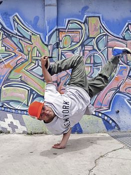 Portrait of a dancing breakdancer at street