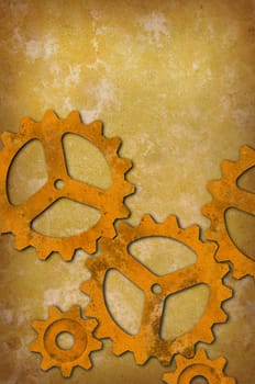 Rusty metal gears against a mottled yellowish background