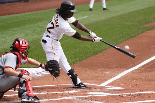 PITTSBURGH - SEPTEMBER 24 : Andrew McCutcheon of the Pittsburgh Pirates swings and connects against the Cincinnati Reds on September 24, 2009 in Pittsburgh, PA.