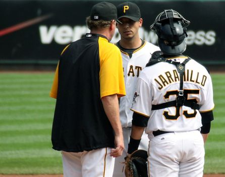 PITTSBURGH - SEPTEMBER 24: Pittsburgh Pirates' pitching coach, Joe Kerrigan speaks with Charlie Morton during a game against Cincinnati Reds on September 24, 2009 in Pittsburgh, PA.