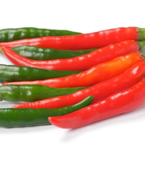 Arrangement of green and red chili peppers isolated on white background