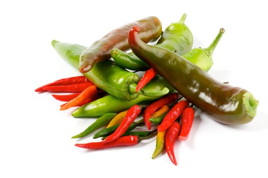 Arrangement of Big and mini green and red Chili Peppers isolated on white background
