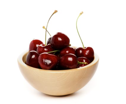 Perfect Sweet Cherry in wooden bowl isolated on white background