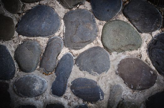 Close up of cobblestones background. High resolution texture