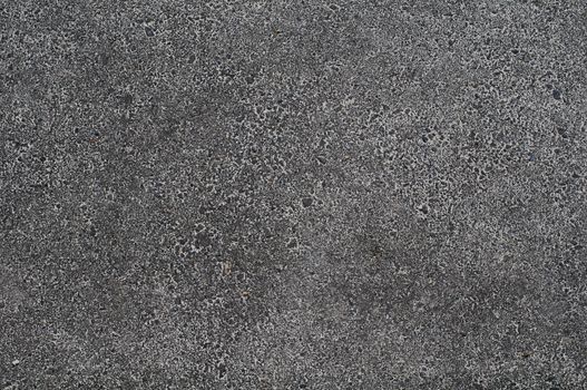 Photo of gray asphalted surface background. Close up