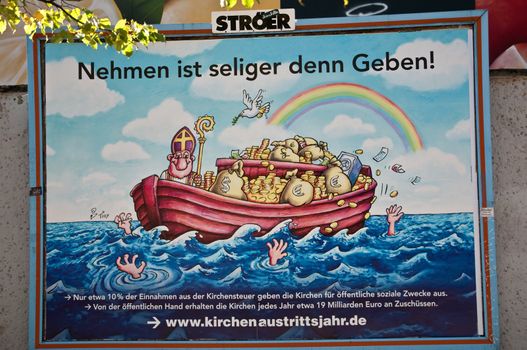 A poster about church tax in Berlin