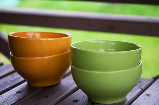 Yellow and green bowls on a table