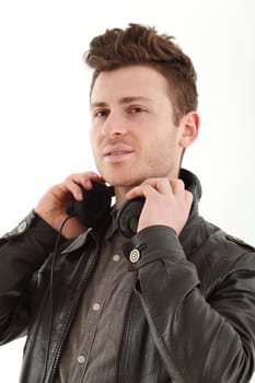 Young adult male with headset listening music isolated on white background