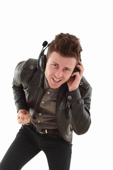 Young adult male with headset listening music isolated on white background