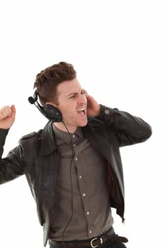 Young adult male with headset listening music isolated on white background