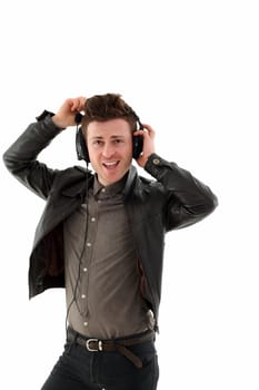 Young adult male with headset listening music isolated on white background