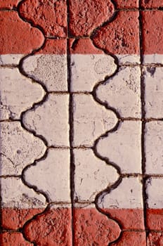 Wall fragment built of intresting bricks. Architectural background.