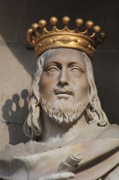 Statue with golden crown at plaza de la constitucion barcelona