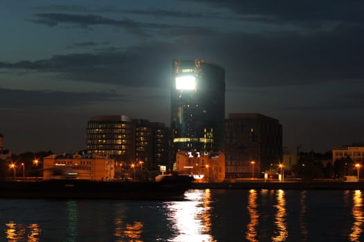 view of the Malookhtinsky embankment in St. Petersburg at night