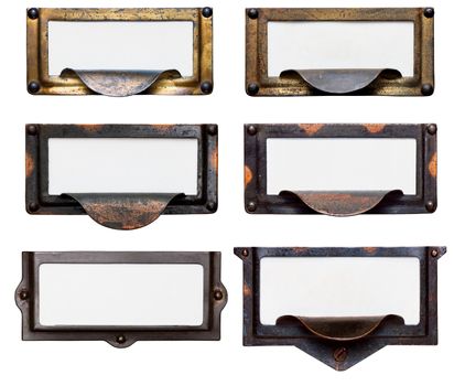 Collection of six old, tarnished brass file drawer label holders and drawer pulls with blank cards. Isolated on white. Includes clipping path.