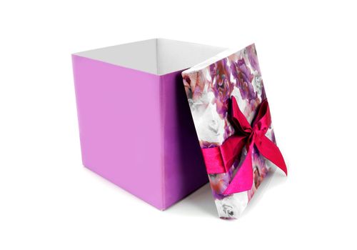 Opened gift box with bow over white background