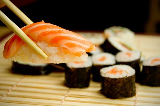 Japanese sushi set. Tuna, sticks on bamboo napkin