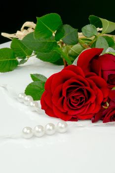 Rose and pearls. Traditional beauty composition isolated on white