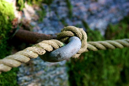 Close-up of thick textile ropes laying on a ship's deck