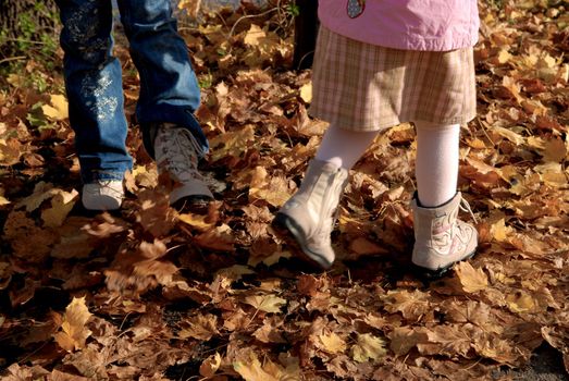 playing with leaves at fall time