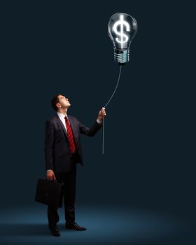 Light bulb and a business person as symbols of creativity in business