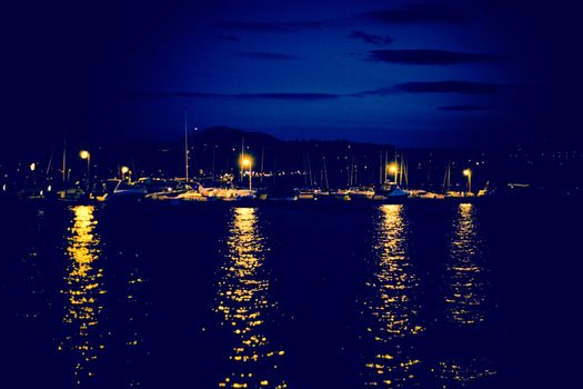 night scene of a small marina bay