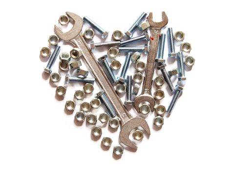 assorted wrench,nuts and bolts heart on white background