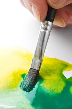 painting paint brush on a white paper