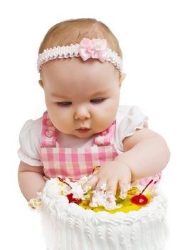 Little girl with a sweet cake in his hands